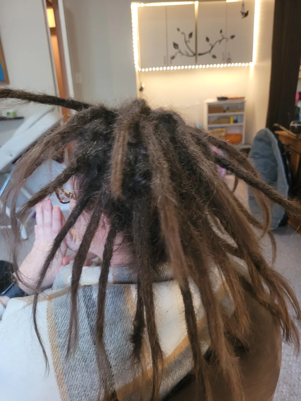 Close view of sectioned dreadlocks during an appointment